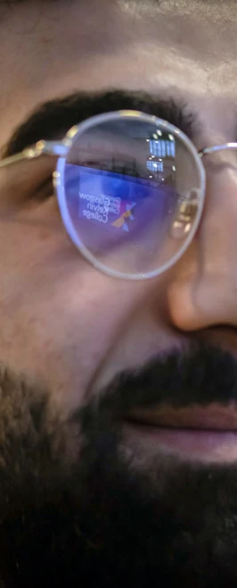 Close-up of a student wearing glasses, with a reflection of Glasgow Kelvin College’s logo visible in the lenses. Close-up of a student wearing glasses, with a reflection of Glasgow Kelvin College’s logo visible in the lenses.